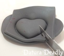 I want to cut the clay from around the heart very carefully, so I do not distort the shape.